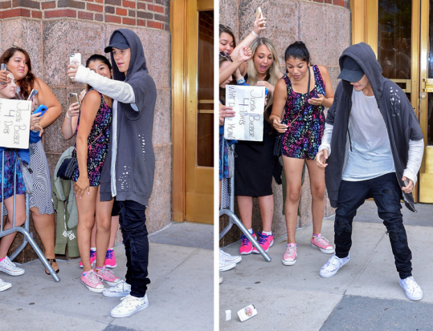  Justin Bieber rơi điện thoại trong khi chụp ảnh tự sướng với người hâm mộ của mình  