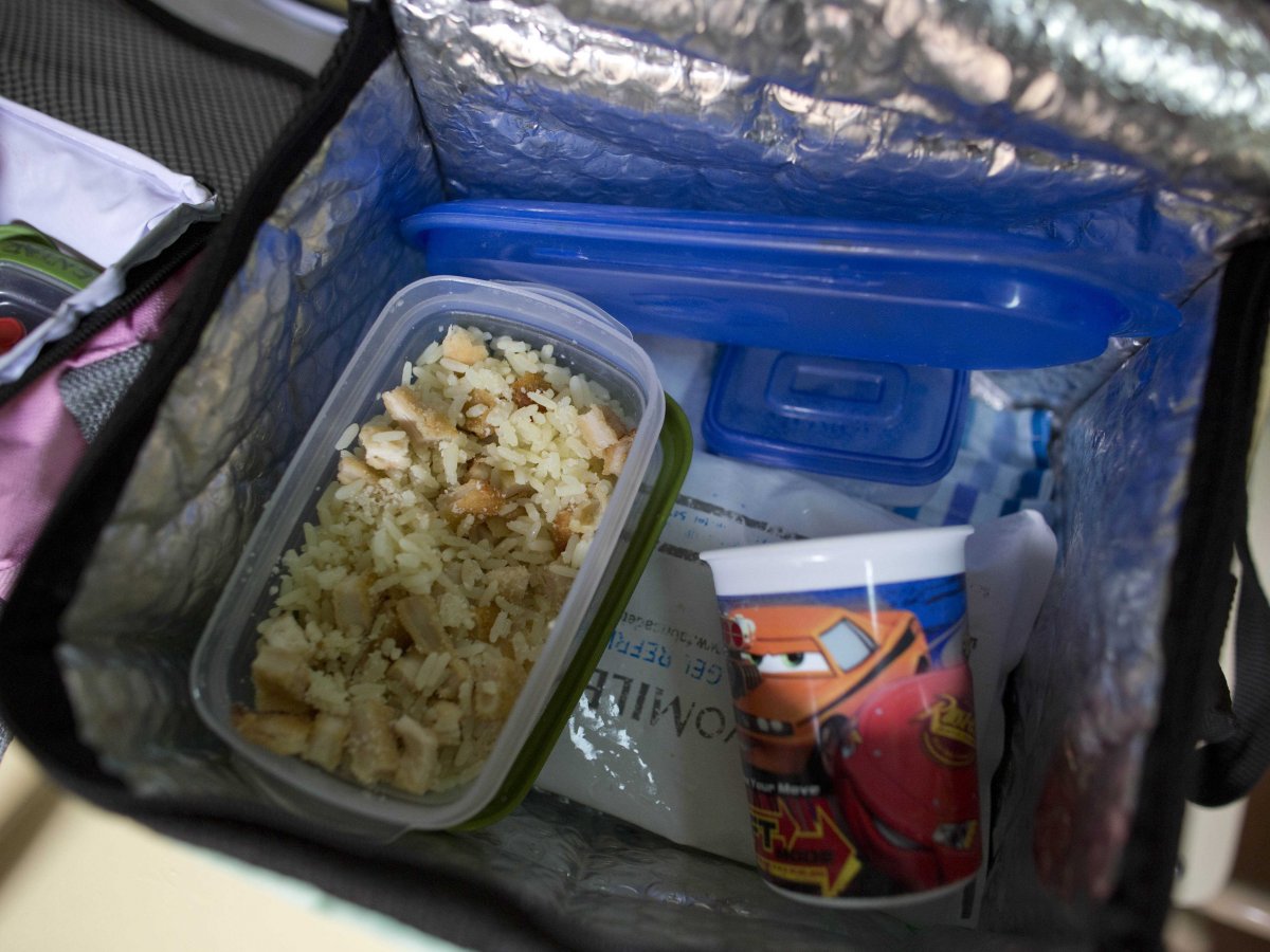 buenos-aires-argentina-a-lunch-box-containing-rice-with-chicken-milanesa-chicken-covered-in-egg-and-bread-crumbs