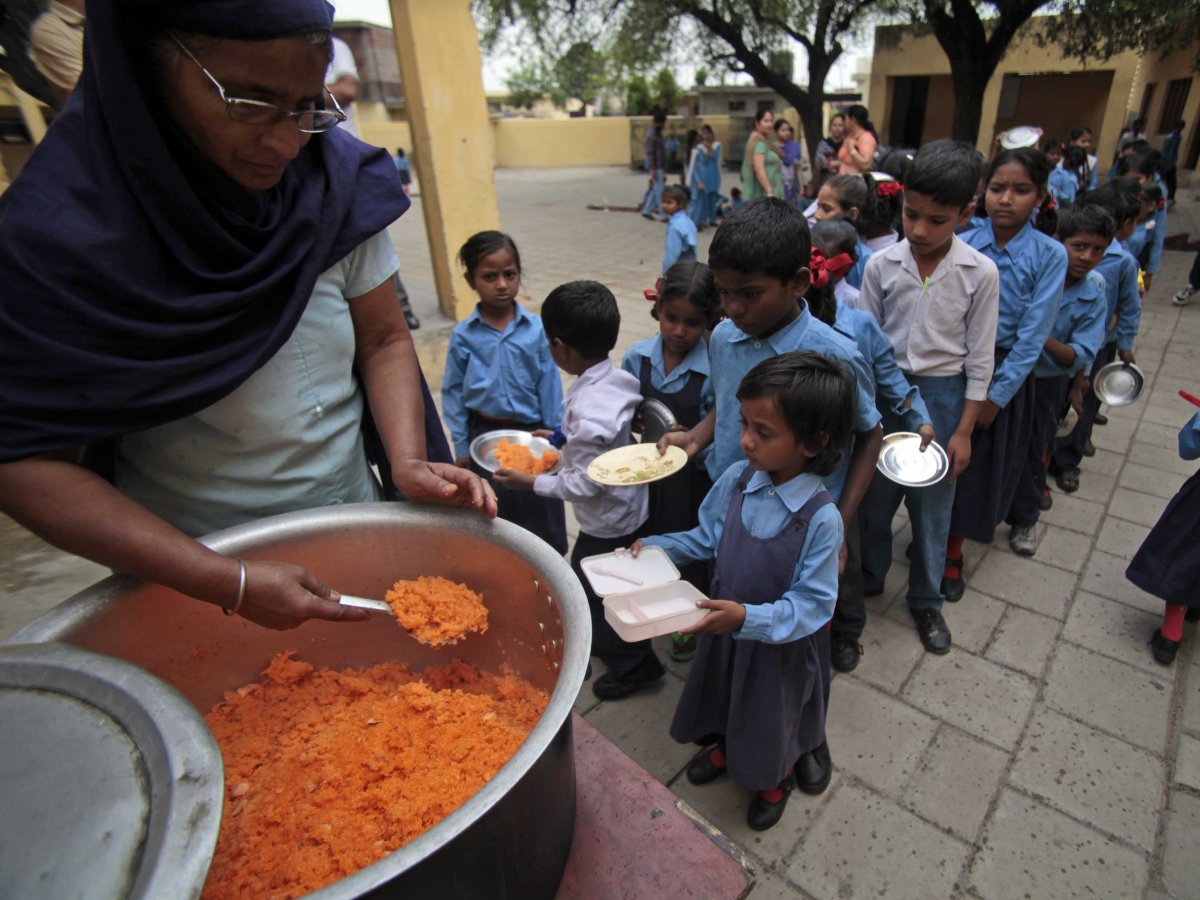 jammu-india-children-stand-in-line-to-receive-a-free-mid-day-meal-of-sweetened-rice