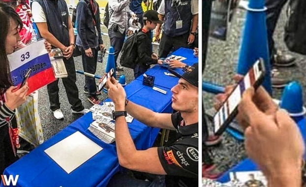   Vận động viên đua xe người Hà Lan tên Max Verstappen chỉ cho người hâm mộ thấy hình ảnh đúng lá cờ của nước mình, vì cô gái đang cầm lá cờ sai  
