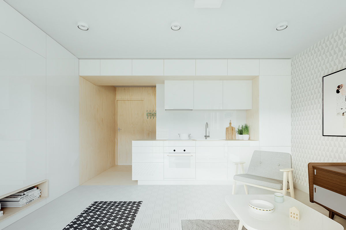 Trong một mặt sàn mở như thế này, căn bếp tối giản màu trắng hòa vào với phần còn lại của không gian sinh hoạt chung cũng màu trắng.