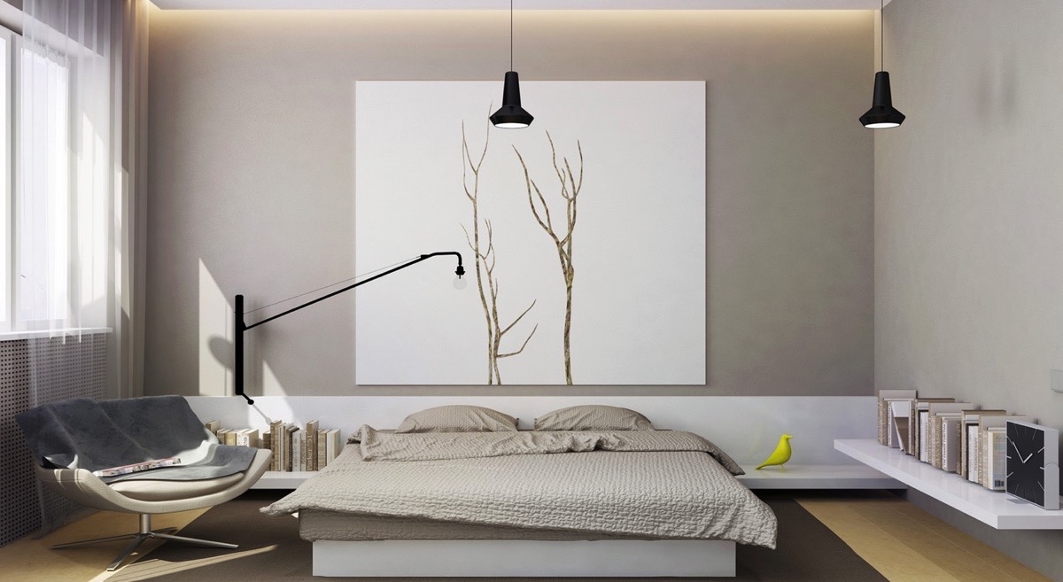Tông màu xám khói, chiếc giường thấp, đơn giản cùng những kệ sách gắn tường làm nổi bật bức tranh lớn treo tường