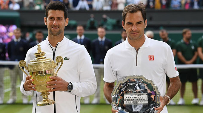 Federer (phải) vẫn có thể tự hào vì những gì đã cống hiến trong cuộc 