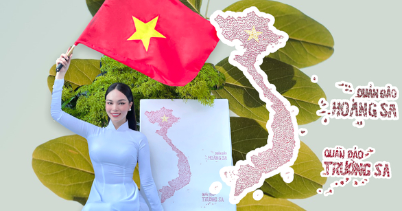 Hương Ly trong tà áo dài trắng bên bức bản đồ Việt Nam và lồng ghép thông điệp về chủ quyền biển đảo ở bài thi tài năng (ảnh: fanpage HHL)
