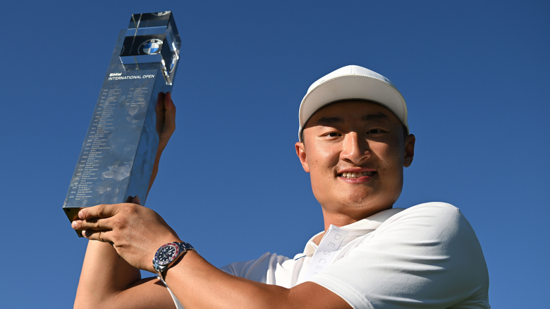 Haotong+Li+of+China+poses+with+the+winner's+trophy+following+Day+Four+of+the+BMW+International+Open-2e13761d-15be-4748-9fdf-c06f8ecb1719