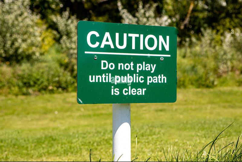 warning-sign-on-a-golf-course-TT74M0