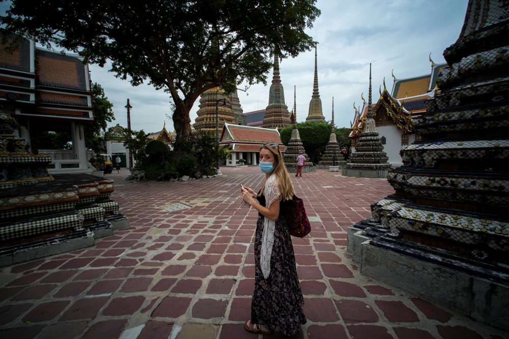 A_tourist_visits_one_of_the_favourite_tourist_spots_as_Thailand_bans_entry_from_8_African_countries_due_to_the_new_Omicron_variant_in_Bangkok_Thailand_November_30_2021._REUTERS