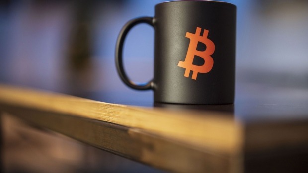 a-bitcoin-logo-on-a-mug-photogra