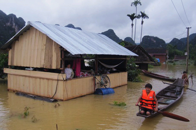 Floating house is used to cope with flood. Photo: T.P