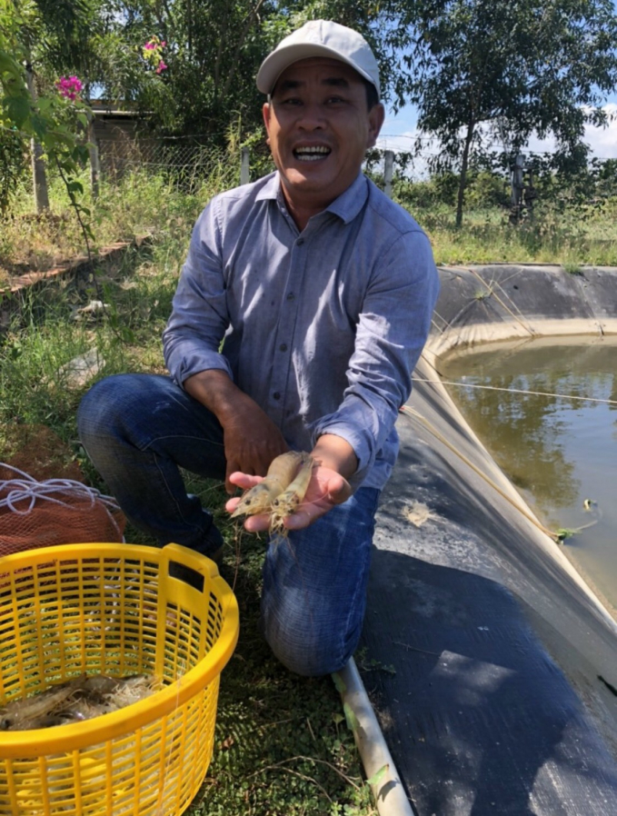 Mr. Vu is filled with excitement upon the results after applying the biotech shrimp farming process of Bo De Group. Photo: Minh Dam.