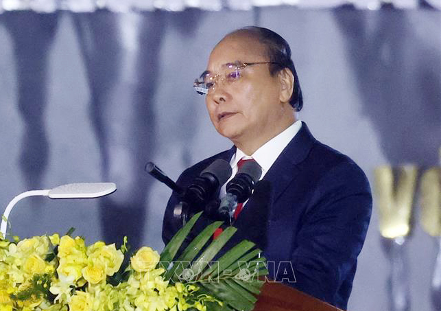 Chủ tịch nước Nguyễn Xuân Phúc phát biểu tại lễ kỷ niệm 65 năm ngày Bác Hồ về thăm Quảng Bình. Ảnh: TTXVN