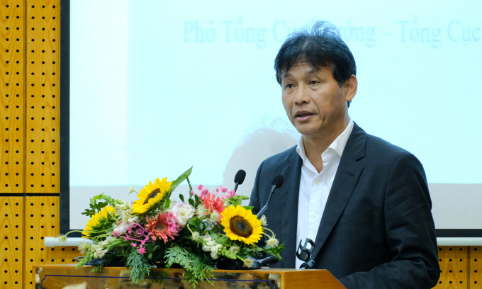 Deputy Director General of the General Department of Taxation Dang Ngoc Minh delivers his speech at the conference.