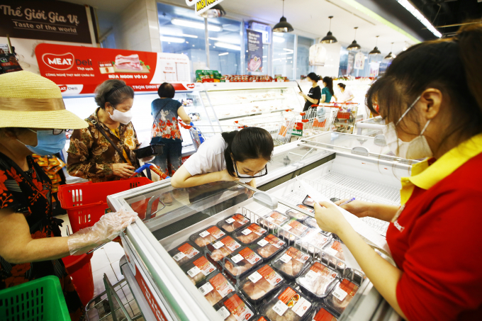 Consumers buying MEATDeli chilled meat products at WinMart supermarket.