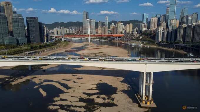 A view of bridges that cross over the partially dried-up riverbed of the Jialing river, a tributary of the Yangtze, that is approaching record low water levels in Chongqing, China, Aug 18, 2022. Photo: Reuters/Thomas Peter