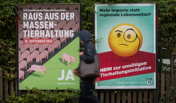 Campaign posters in Zurich. On the left it reads: ‘Get out of factory farming – yes.’ On the right it says: ‘More imports instead of regional food? No.’ Photo: Arnd Wiegmann/Reuters
