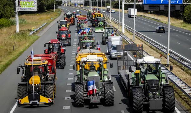 Dutch farmers stage a go-slow protest against government plans to cut nitrogen emissions. Photo: Sem van der Wal/ANP/AFP