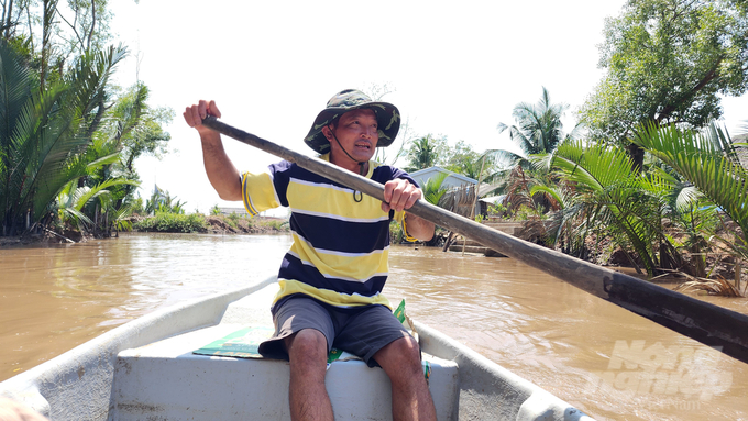 Mr. Dung shared that the forest has grown thicker over the years and reached out to the sea, forming a shield protecting the people living in Cu Lao Dung. Photo: Kim Anh.