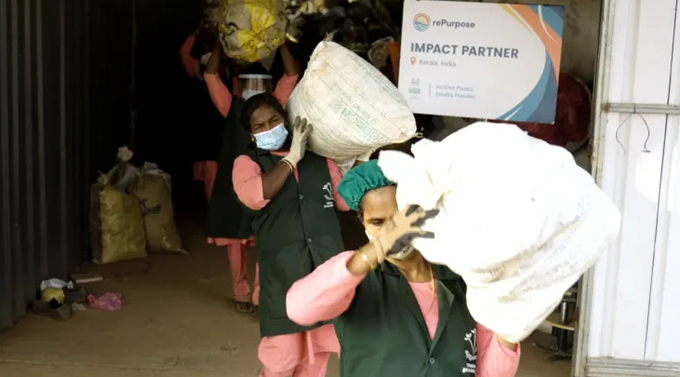 Workers with RePurpose Global’s partner organization Green Worms collect plastic in Kerala, India.