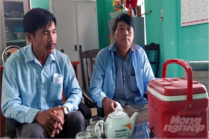 Animal health staffs waiting for their turn to receive vaccines for livestock. Photo: Vo Dung.