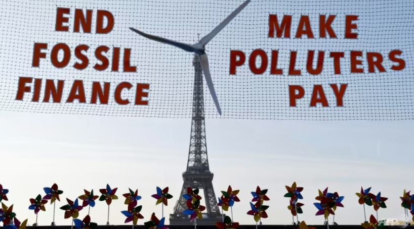 Activists demonstrated against fossil fuel finance in central Paris on the eve of the summit Photo: AFP/File/LUDOVIC MARIN