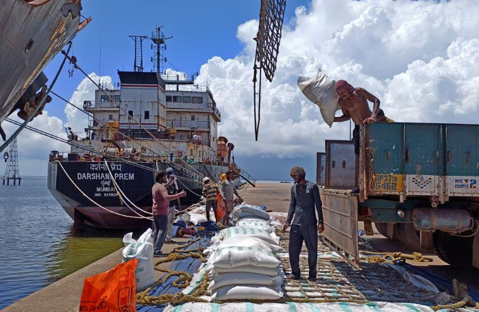 Labourers unload rice bags from a supply truck at India's main rice port at Kakinada Anchorage in the southern state of Andhra Pradesh, India, September 2, 2021. Picture taken September 2, 2021. REUTERS/Rajendra Jadhav