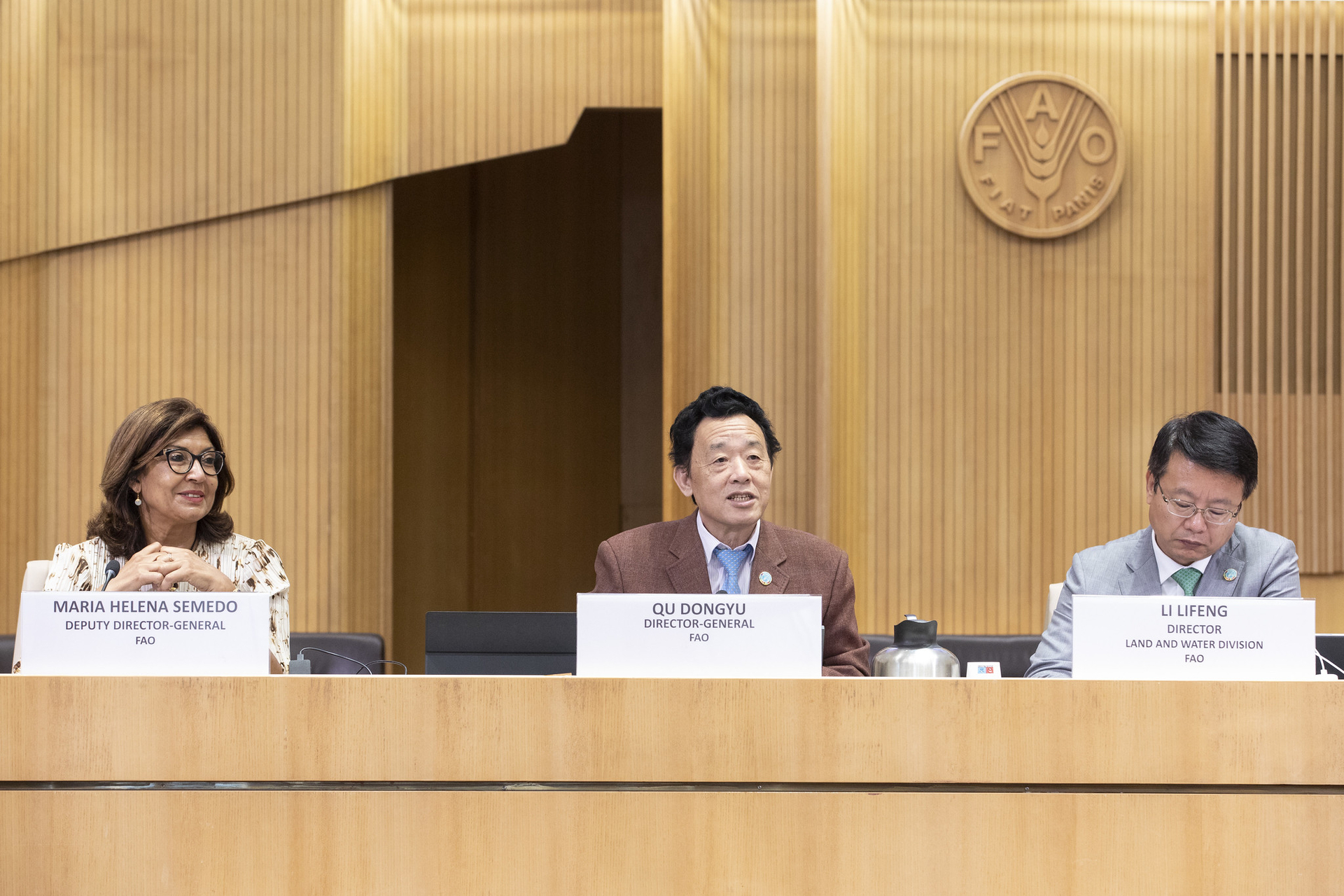 FAO Director-General QU Dongyu, center, Deputy Director-General Maria Helena Semedo, left, and Lifeng Li, Director of Land and Water Division, right.