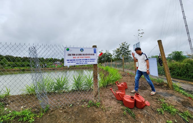 The climate change-resistant pond project helps Mr Thang and surrounding households to have water for irrigation during the dry season. Photo: Quang Yen.