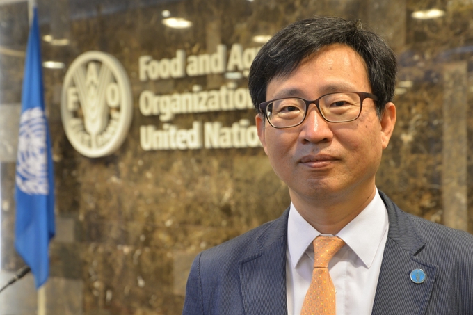 Mr. Jong-Jin Kim, Assistant Director-General and Regional Representative for Asia and the Pacific, Food and Agriculture Organization of the United Nations (FAO). 