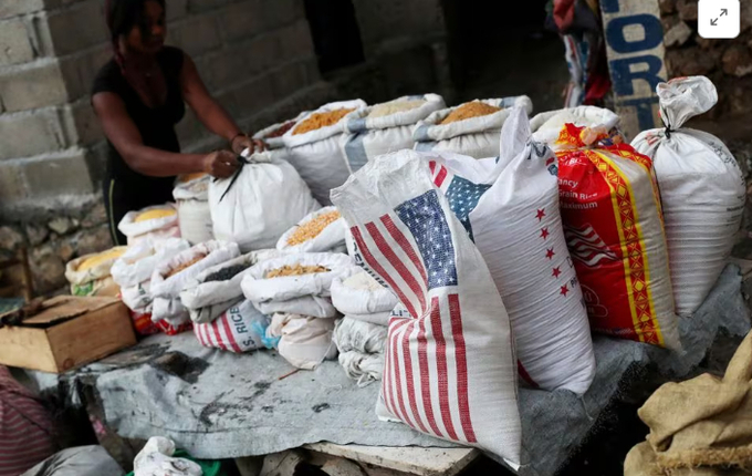 A local sells rice and grains at a street market in Port-au-Prince, Haiti, February 19, 2019. 