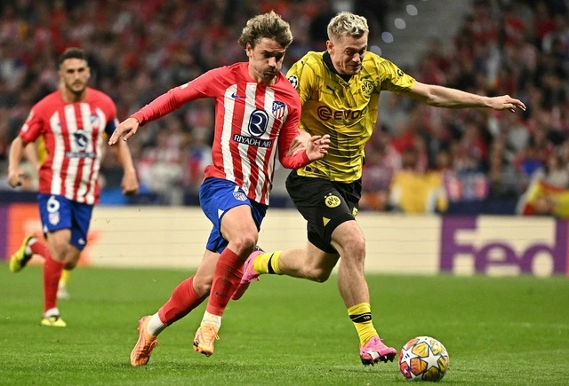 Trận Atletico Madrid (trái) thắng Borussia Dortmund tỷ số 2-1 ngày 11/4. Ảnh: AFP