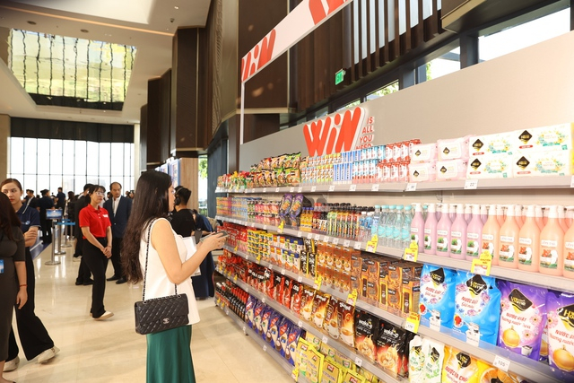 Guests experience the WIN store system with the message 'All you need'. Photo: Masan.