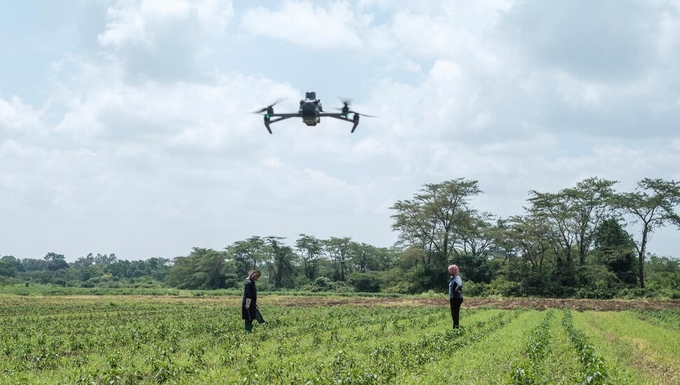 A drone flies over a farm in Tanzania.