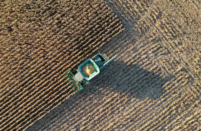 A farmer harvests corn in this aerial photograph taken over Woodburn, Indiana, U.S., October 16, 2020. Picture taken with a drone October 16, 2020.