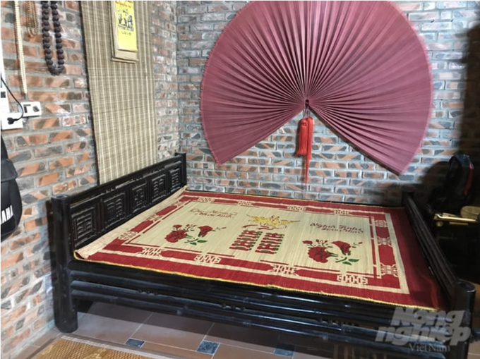 The hundred-year-old bamboo bed – a precious artifact that artisan Nguyen Van Ky is preserving in the three-room tiled house of his family.