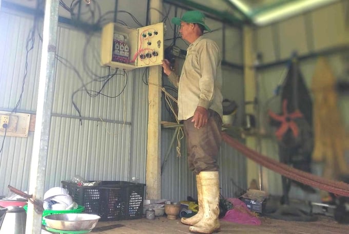 Nguyen Ngoc Thuong operating an automated irrigation system for his fruit tree farm. Photo: V.D.T.