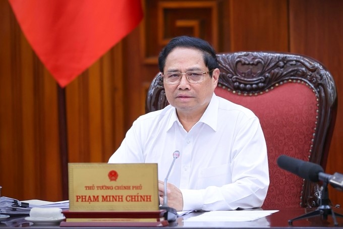 Prime Minister Pham Minh Chinh: Each person works as two and joins hands to respond and overcome consequences of storms and floods with the highest responsibility. Photo: VGP.