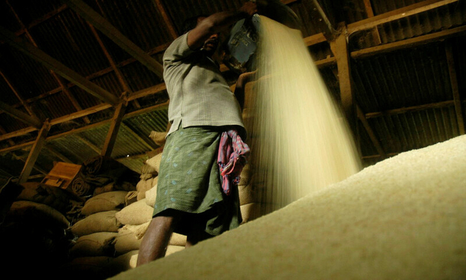 A labourer works at a rice mill in India’s Ranipur.