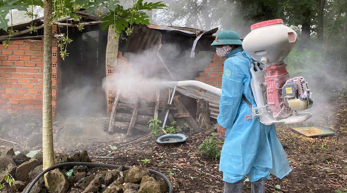 Local authorities disinfecting the site of the outbreak. Photo: Quang Yen.