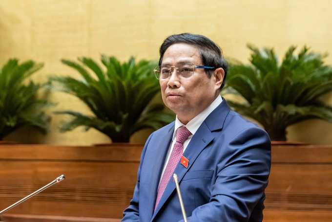 Prime Minister Pham Minh Chinh presents the Government's Report at the opening session. Photo: National Assembly.