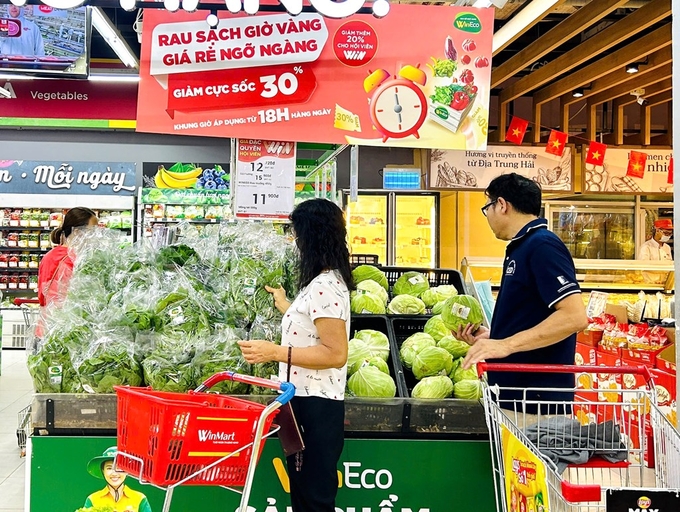 Customers shopping for clean WinEco produce at WinMart and WinMart+ supermakets.