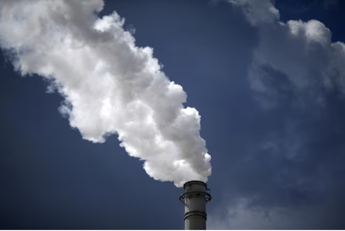 Steam is released from a petroleum refinery in Sulphur, Louisiana, U.S., June 12, 2018.