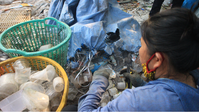 Mrs.M struggles with plastic products everyday. Photo: Minh Toan.