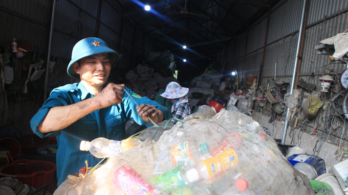 Mr. Huy has lived with plastic and make a living by selling plastic. Photo: Minh Toan.