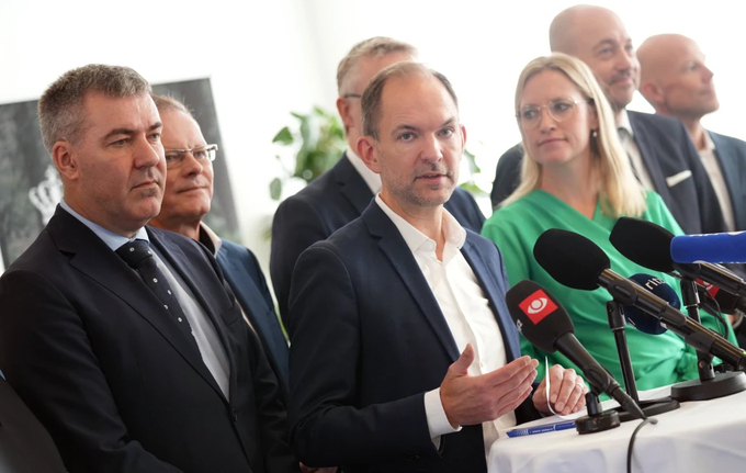 Denmark’s Minister for the Green Tripartite Jeppe Bruus, center, and members of the coalition present a political agreement on the so-called green tripartite deal at the ministry in Copenhagen, Denmark, Monday, Nov. 18, 2024. 