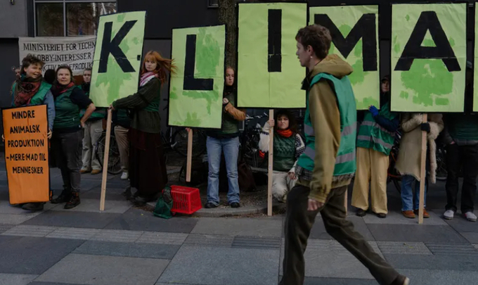 Environmentalists outside the Danish ministry last month as the tax was being negotiated in Copenhagen. Photo: Charlotte de la Fuente / The New York Times.