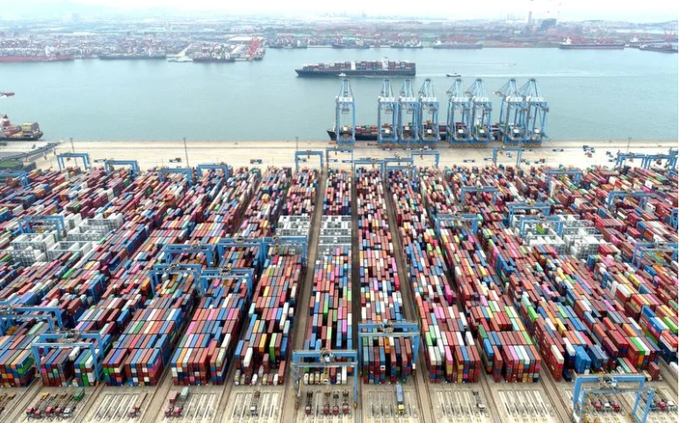 Containers and cargo vessels at the Qingdao port.