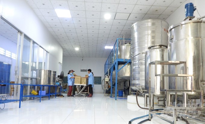 Inside the factory producing fish sauce from cashew fruits  of Vuong Ngoc Vegan Company. Photo: Tran Trung.