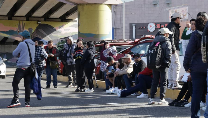 Migrants wait at the Chaparral checkpoint in Tijuana, Mexico, Jan. 20, 2025. Minutes after U.S. President Donald Trump took office, the U.S. Customs and Border Protection (CBP) announced it has canceled all scheduled appointments for immigration and border processing. 