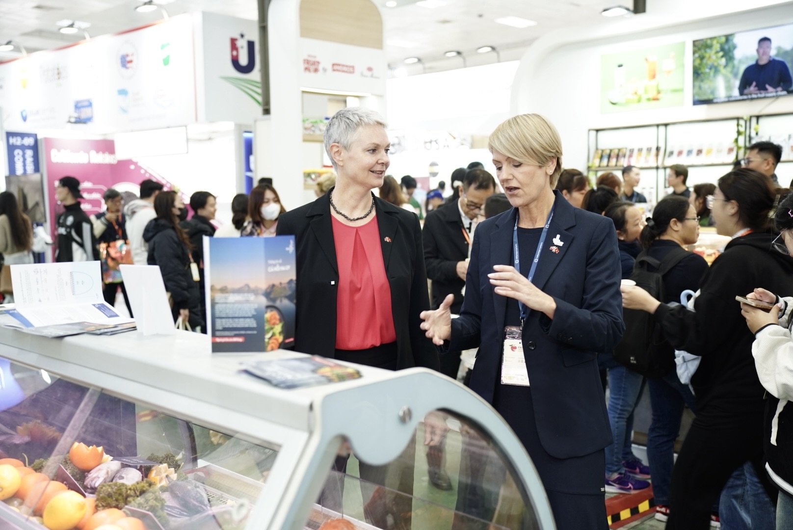 Ms. Hilde Solbakken, Norwegian Ambassador to Vietnam (left) talks with Åshild Nakken, Director of Southeast Asia of the Norwegian Seafood Council (NSC) at the NSC booth at the Food & Hospitality Exhibition, Hanoi. Photo: HT.