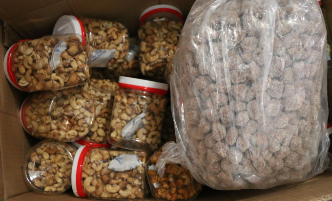 All poor quality cashew nut products are seized at the four households after a period of investigation by Environmental Police and market authorities. Photo: CACC.